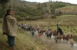 Members of the Mapuches Indians Movement ride their horses during the burial ceremony of Collio near Temuco city