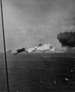 "Jap torpedo bomber explodes in air after direct hit by 5 inch shell from U.S. aircraft carrier as it attempted an unsuccessful attack on carrier, off Kwajalein." U.S.S. Yorktown. CPhoM. Alfred N. Cooperman, December 4, 1943.