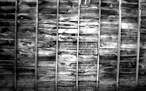 old_wooden_wall_in_black_and_white-wide