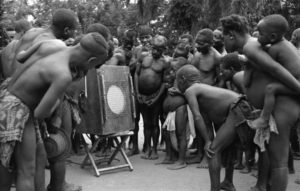 Batwa pigmies listening to playback 2, Congo, 1949.